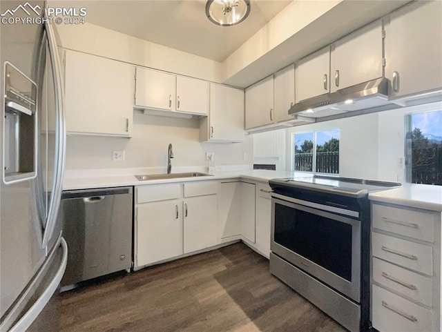 kitchen featuring white cabinets, dark wood-type flooring, sink, and stainless steel appliances