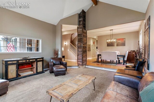 living room featuring brick wall, carpet flooring, high vaulted ceiling, beam ceiling, and a notable chandelier