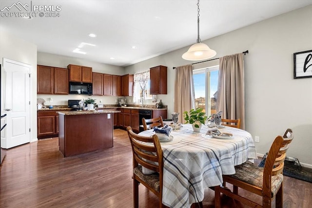 dining area with dark wood-type flooring