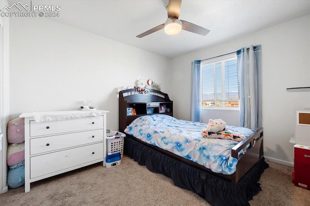 bedroom featuring light colored carpet and ceiling fan