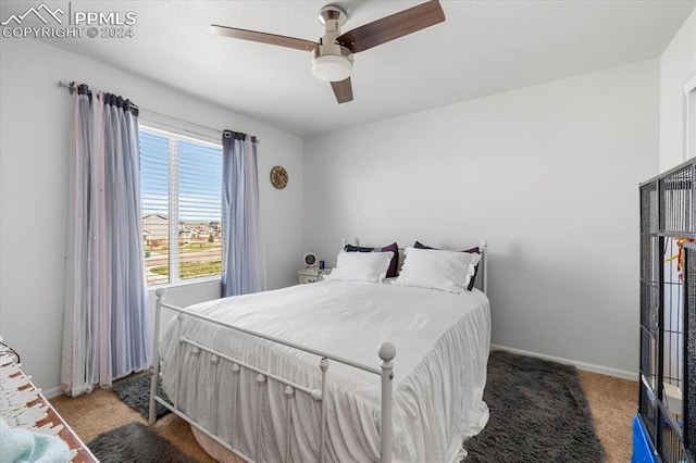 carpeted bedroom with ceiling fan