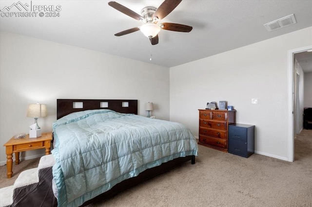 carpeted bedroom featuring ceiling fan