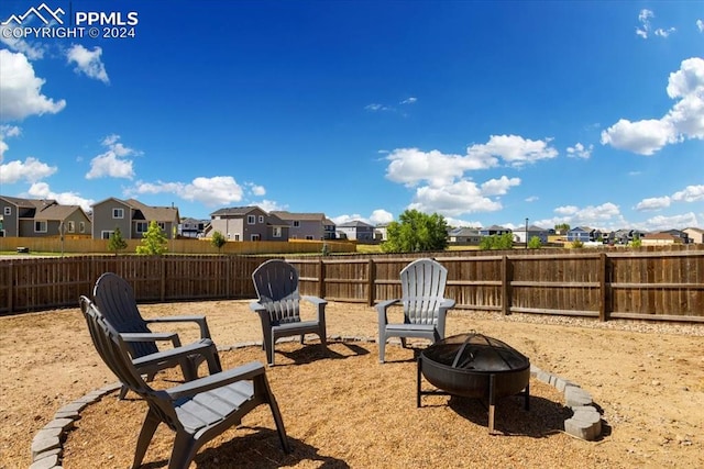 view of yard with an outdoor fire pit