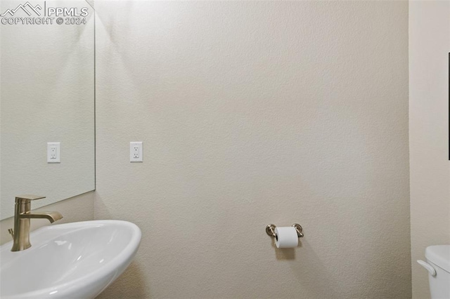 bathroom with sink and toilet