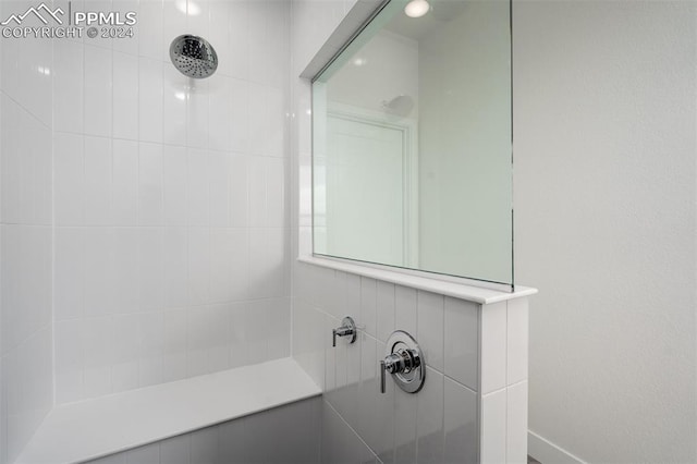 bathroom featuring tiled shower