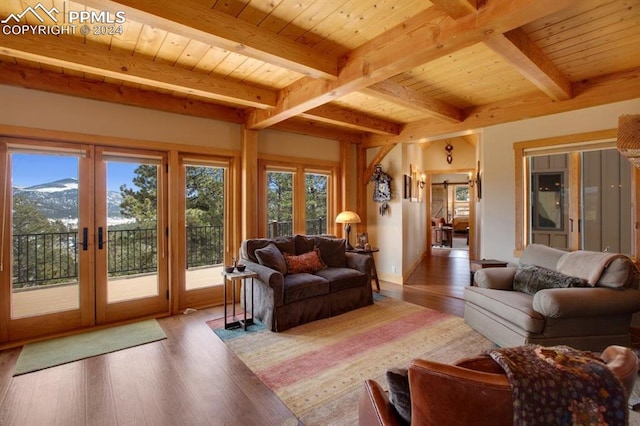 living room featuring french doors, wood ceiling, and light hardwood / wood-style flooring