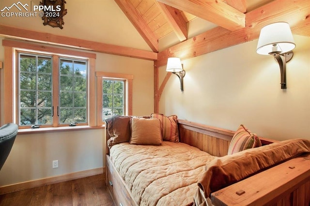 bedroom with vaulted ceiling with beams and dark wood-type flooring