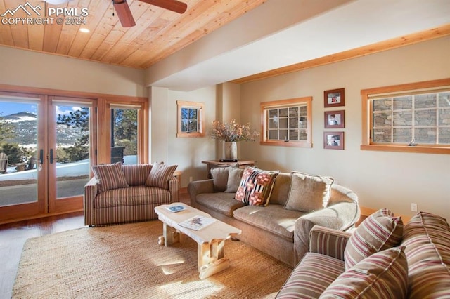 living room featuring wooden ceiling, ceiling fan, light hardwood / wood-style flooring, and french doors