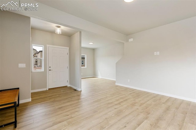 entryway with light hardwood / wood-style flooring