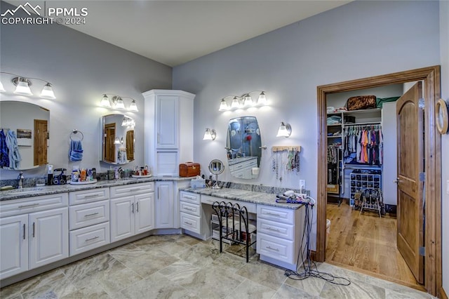 bathroom featuring vanity and tile floors