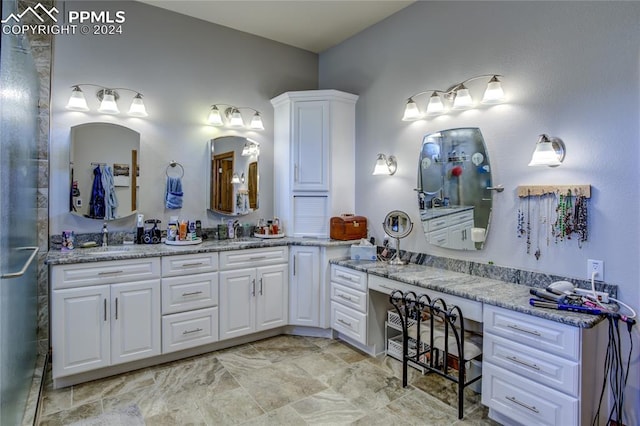 bathroom with tile floors and vanity with extensive cabinet space