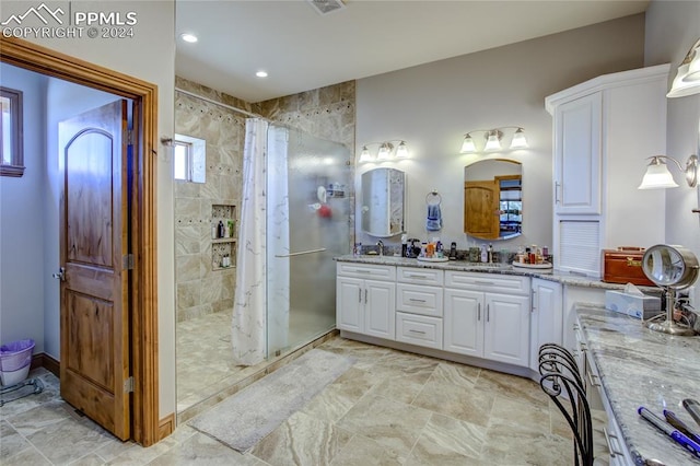 bathroom featuring a shower with curtain, dual bowl vanity, and tile flooring