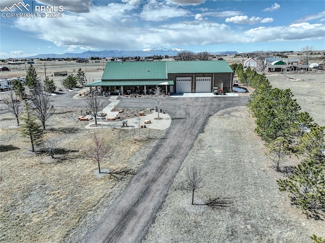 view of front of house featuring a mountain view and a garage