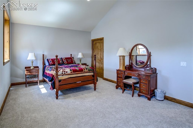 bedroom with light carpet and lofted ceiling