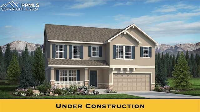 exterior space with a porch, a mountain view, and a garage