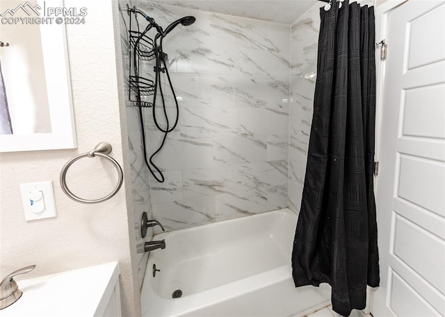 bathroom with shower / bath combo with shower curtain