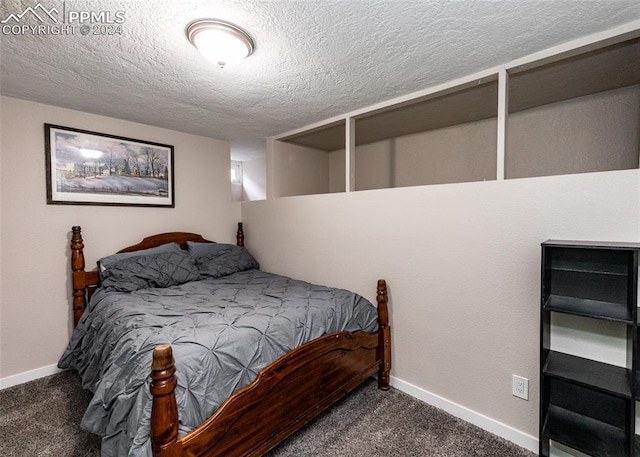 carpeted bedroom with a textured ceiling