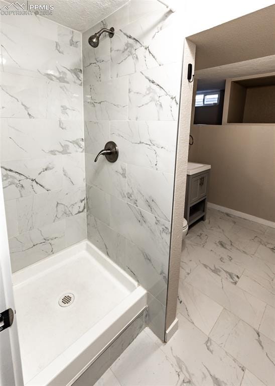 bathroom featuring vanity, tile flooring, and toilet