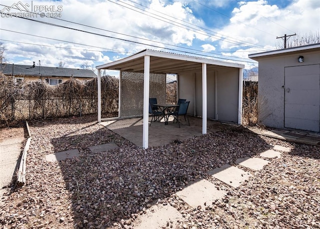 view of terrace featuring a storage unit