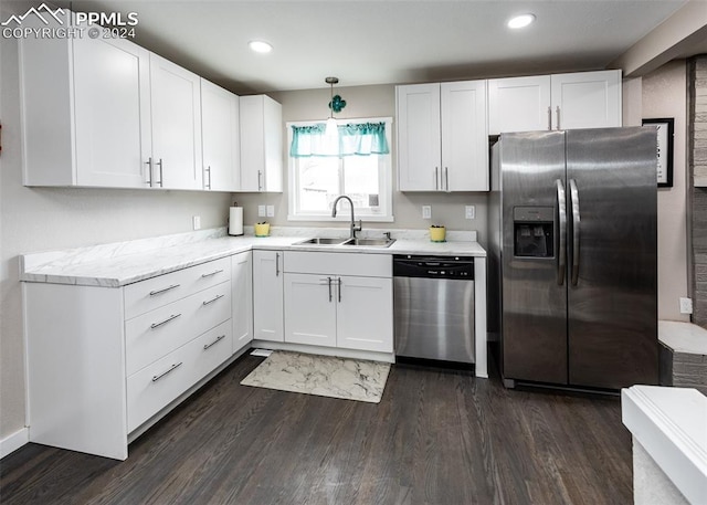 kitchen with white cabinets, dark hardwood / wood-style floors, sink, and stainless steel appliances