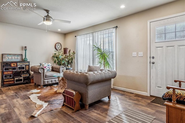 living room featuring ceiling fan