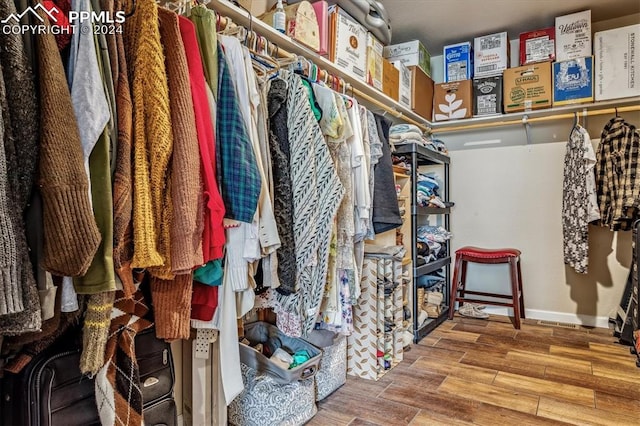 spacious closet featuring hardwood / wood-style flooring