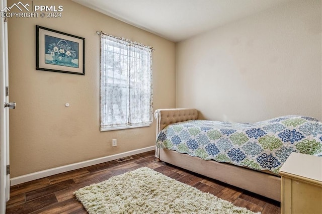 bedroom featuring dark wood-type flooring