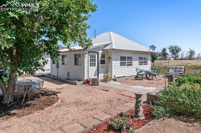 rear view of house featuring a patio