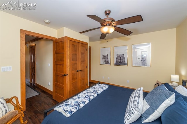 bedroom featuring a closet, ceiling fan, and dark hardwood / wood-style flooring