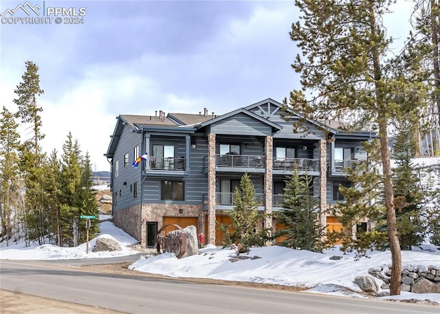 view of front of home with a balcony and a garage