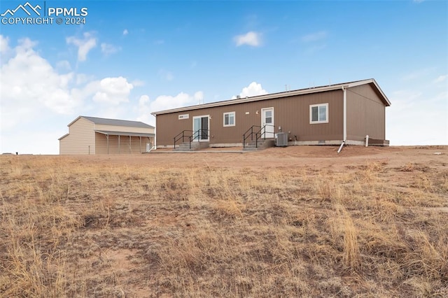 back of property with central air condition unit