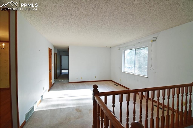 interior space featuring a textured ceiling