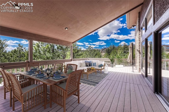 wooden deck featuring an outdoor living space