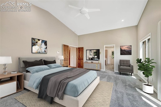 bedroom featuring high vaulted ceiling, light carpet, and ceiling fan