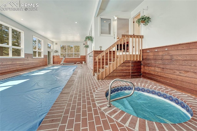 view of pool featuring an indoor hot tub