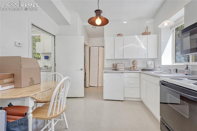 kitchen featuring hanging light fixtures, white appliances, a healthy amount of sunlight, and white cabinetry