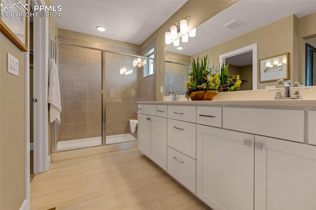 bathroom featuring vanity and walk in shower