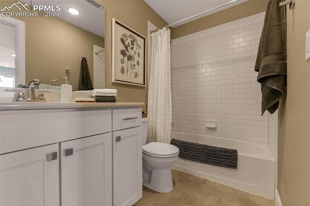 full bathroom featuring vanity, toilet, and shower / tub combo with curtain