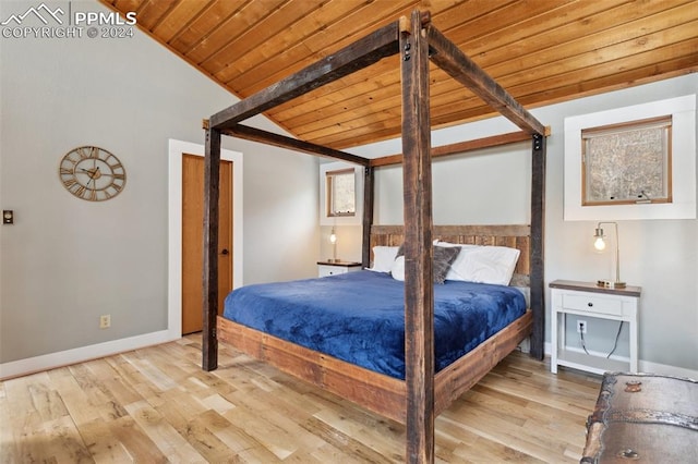 bedroom with lofted ceiling with beams, light hardwood / wood-style floors, and wooden ceiling