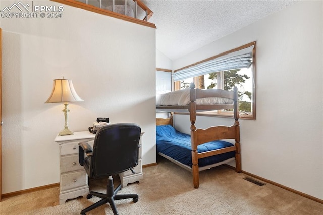 bedroom featuring light carpet, a textured ceiling, and lofted ceiling