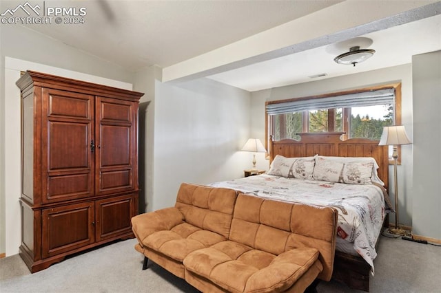 bedroom with light colored carpet