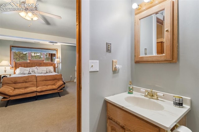 bathroom with ceiling fan and vanity