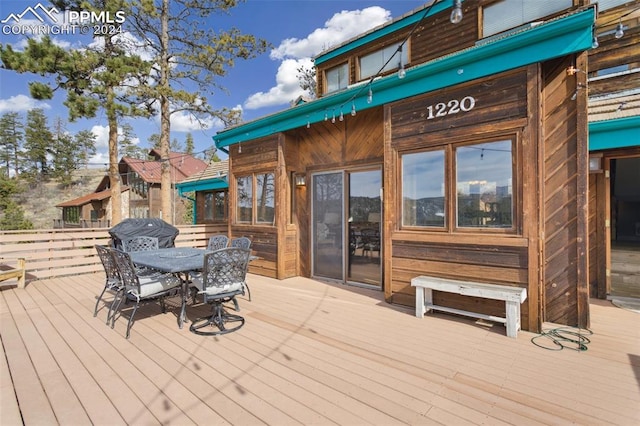 wooden deck featuring grilling area