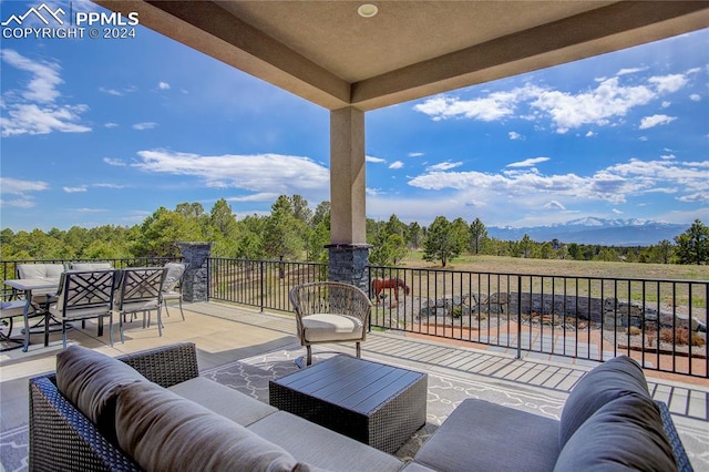 view of patio with a balcony and an outdoor hangout area