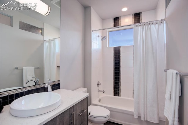 full bathroom with shower / bath combo, toilet, and large vanity