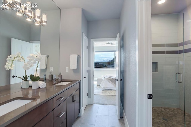 bathroom with dual bowl vanity, tile flooring, and a shower with shower door