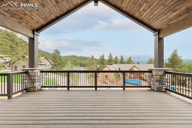 wooden deck featuring a swimming pool