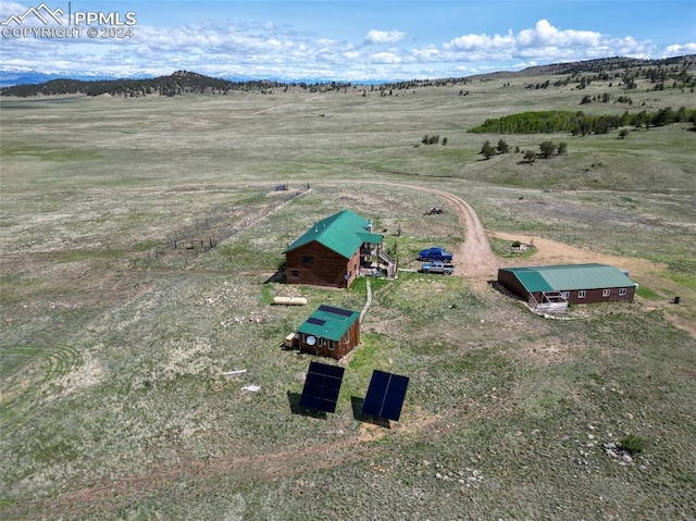 birds eye view of property with a rural view