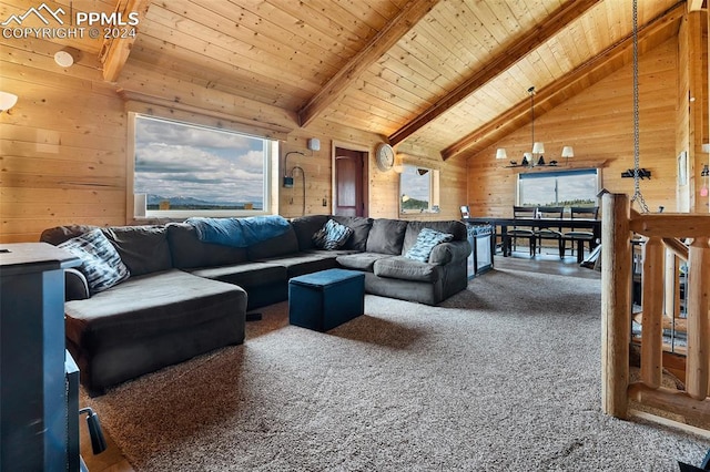 carpeted living room featuring wood walls, a notable chandelier, beamed ceiling, and wooden ceiling