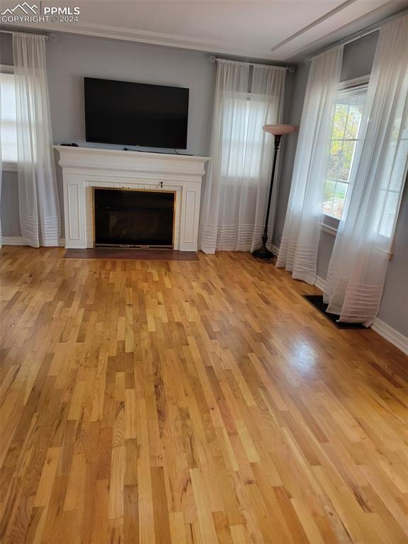 unfurnished living room with light wood-type flooring